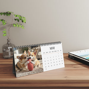 Corgi Calendar with May page displayed on a wooden desk