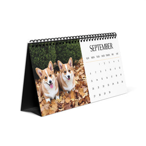 Desk calendar with two corgis on the cover and September page open.