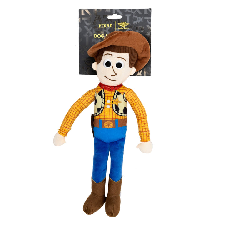 Plush toy resembling a Woody character from Pixar with a packaging tag in the background