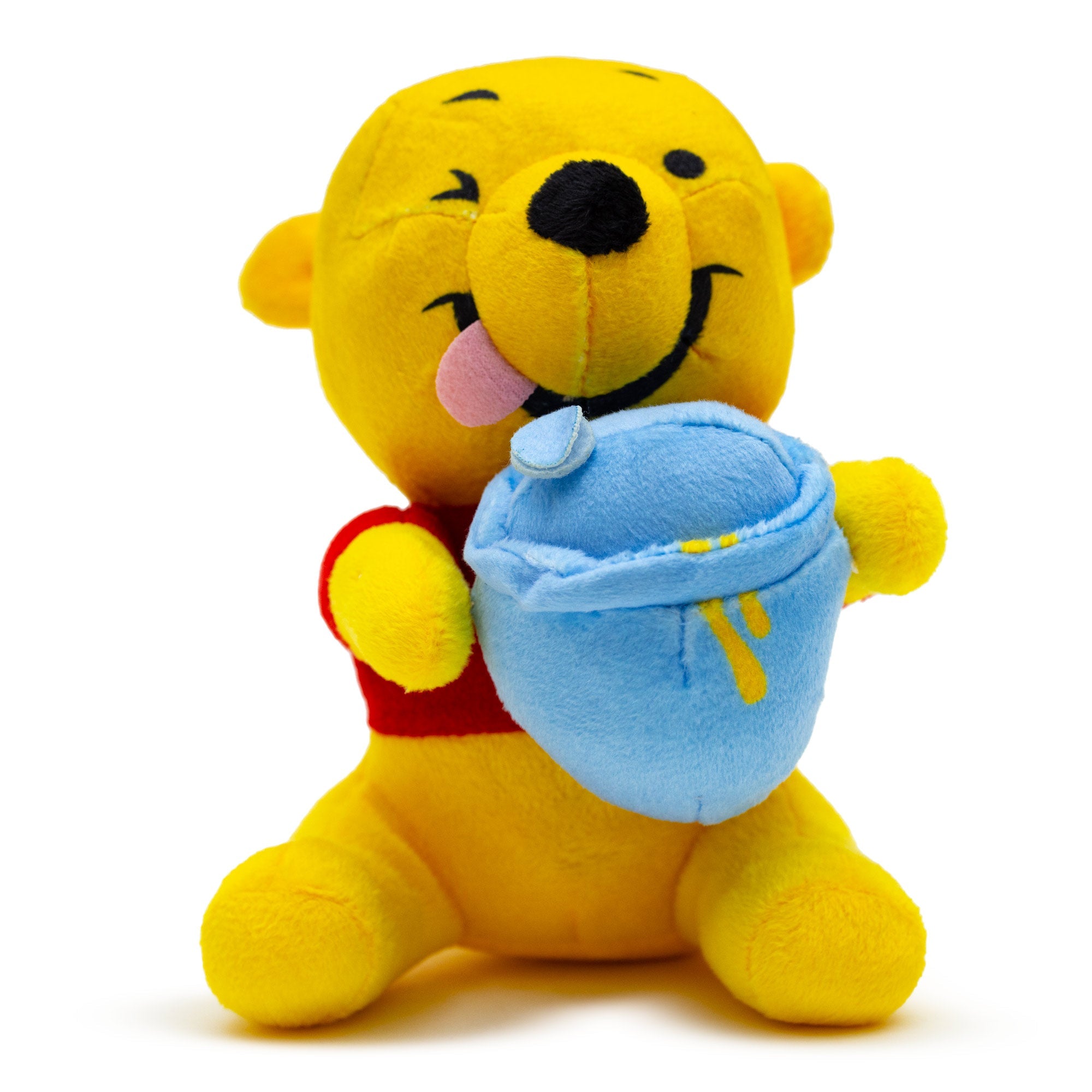 A plush dog toy featuring Winnie the Pooh winking and sitting holding a blue hunny pot with a squeaker mechanism.