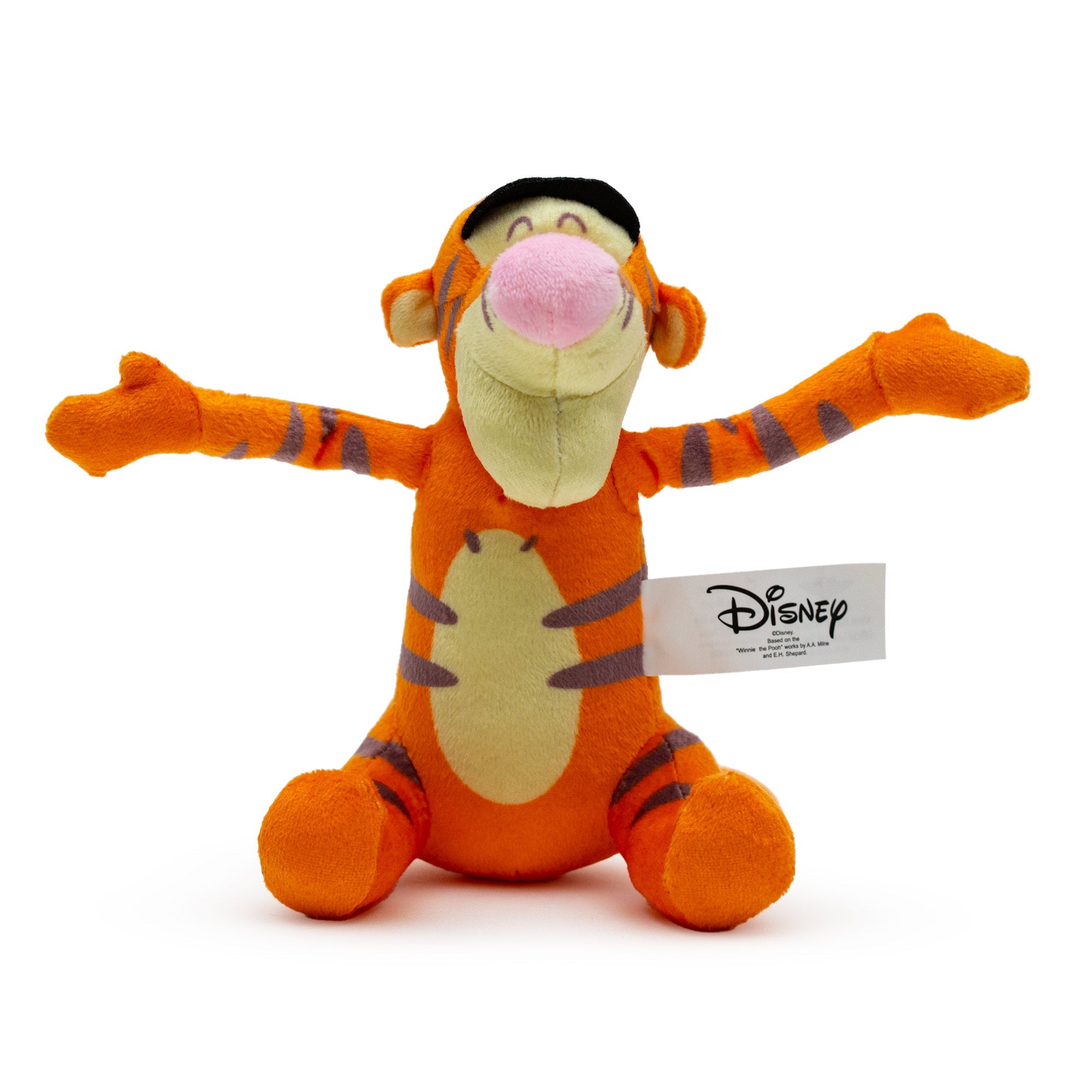 A plush dog toy in the shape of Tigger from Winnie the Pooh, featuring the character in a sitting pose with arms raised.