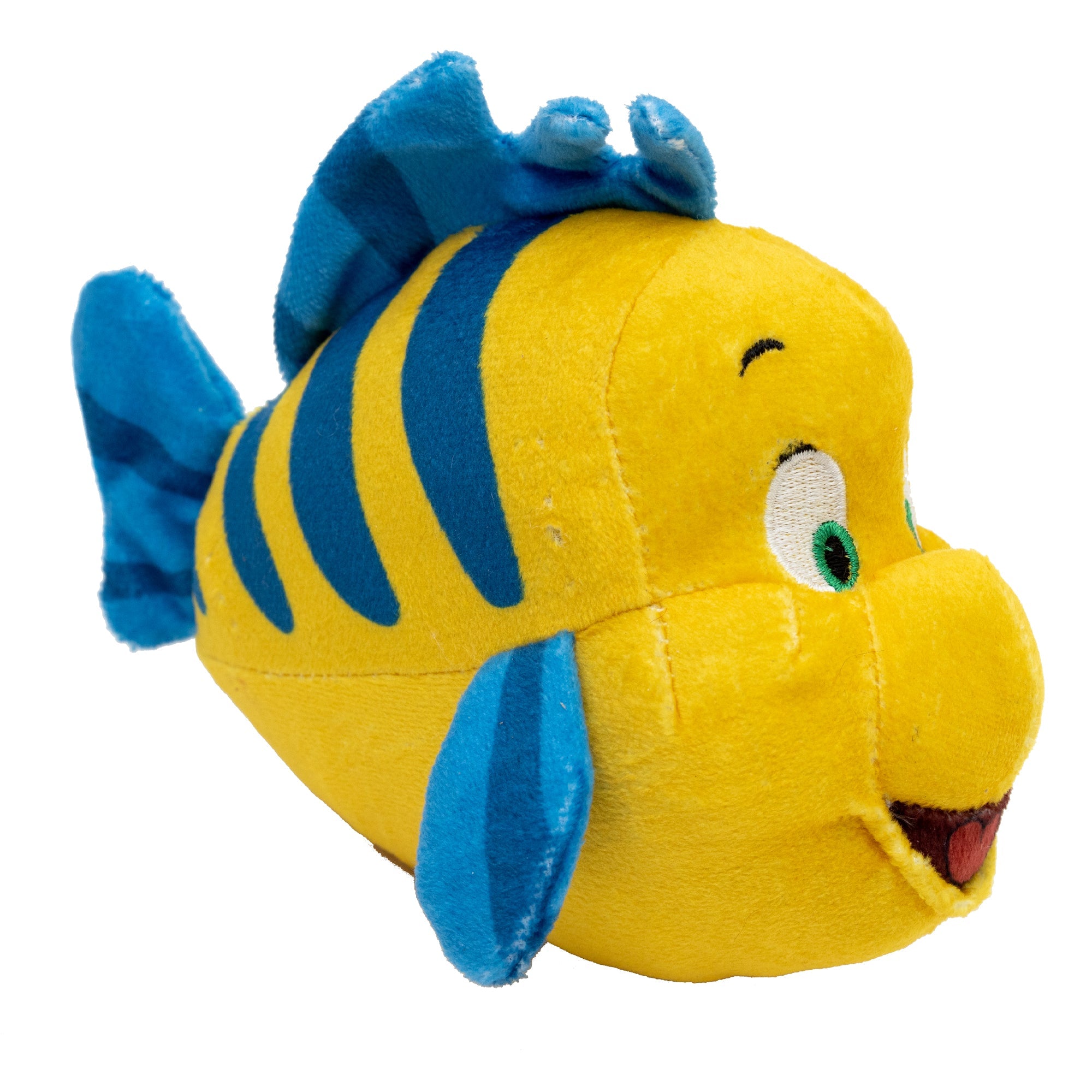 A plush dog toy in the shape of a yellow and blue fish with a happy expression and a small fish attached to its tail.